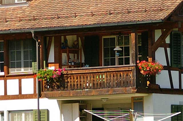 Example of a wooden balcony on an old traditional country house in Switzerland