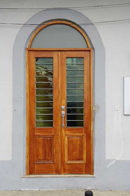 Photo Example of a renovated traditional old door with natural wood finish, the picture of this door was taken en in the old colonial part of Panama City.