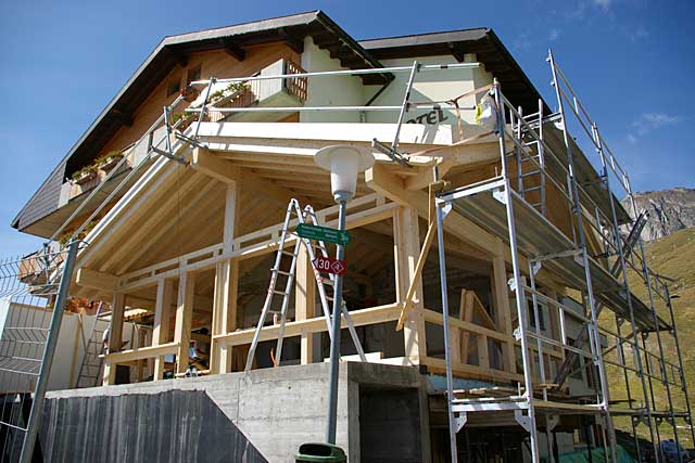 Example of a traditional alpine chalet under construction in the Swiss mountains. 