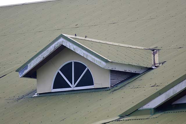 Example photo of a typical zinc roofing with a roof window in a tropical region